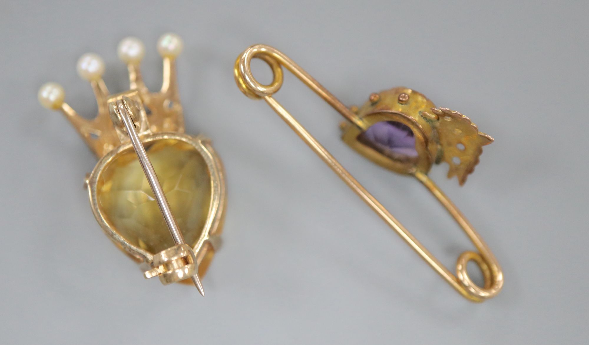 A late Victorian 9ct gold, heart shaped citrine and seed pearl set coronet brooch, 25mm and an amethyst set bar brooch